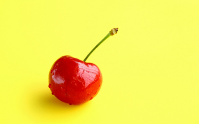 Red apple yellow background stem free wallpaper - medium preview image