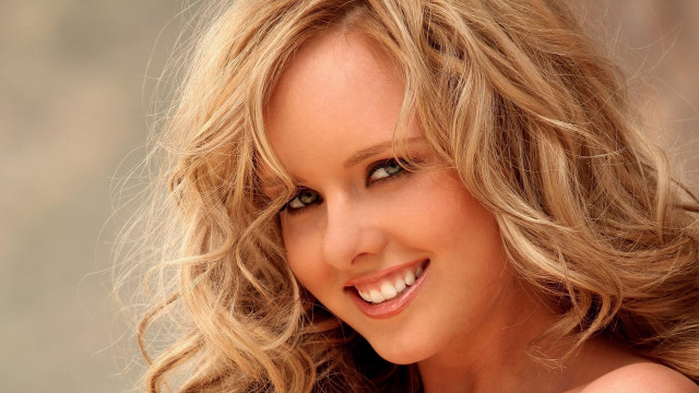 Blonde haired smile wind blown free wallpaper - medium preview image