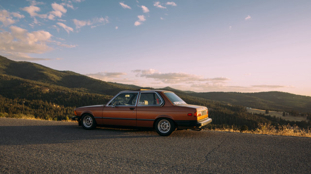 Mountain road sunset car window free wallpaper - medium preview image