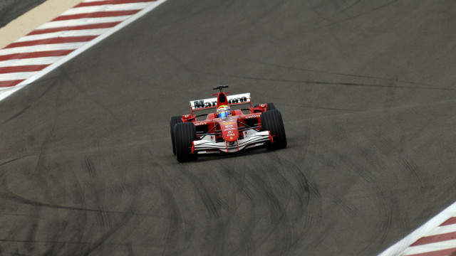 Man driving racing car red free wallpaper - medium preview image