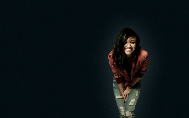 Woman smiling dark background jacket free wallpaper - medium preview image