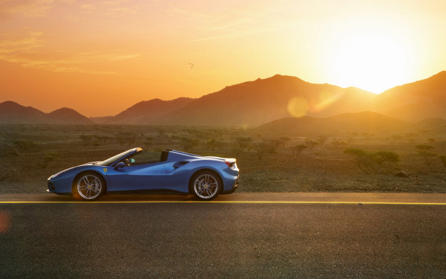 Blue sports car sunset mountains free wallpaper - medium preview image