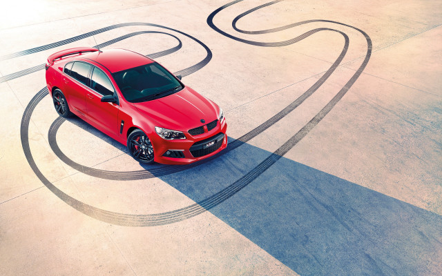 Red car curved road spiral free wallpaper - medium preview image