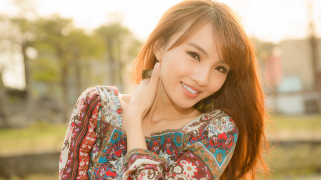 Red haired woman floral shirt free wallpaper - medium preview image