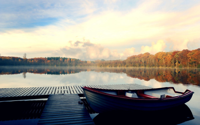 Docked boat lake trees clouds free wallpaper - medium preview image