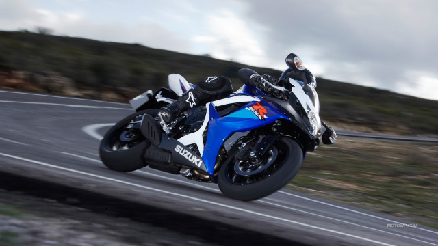 Motorcycle ride hill cloudy sky free wallpaper - medium preview image