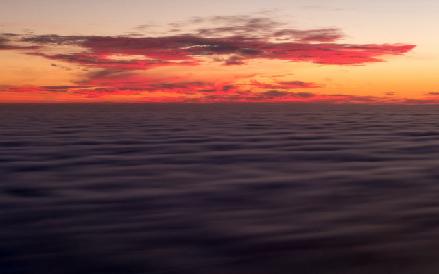 Sunset water clouds plane volumetric free wallpaper - medium preview image