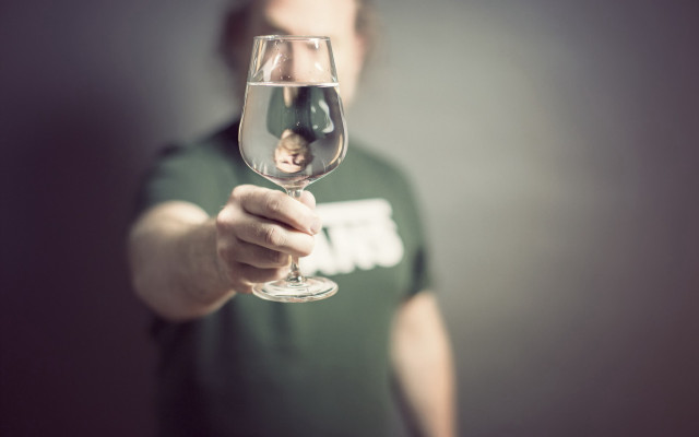 Man holding wine glass doll free wallpaper - medium preview image