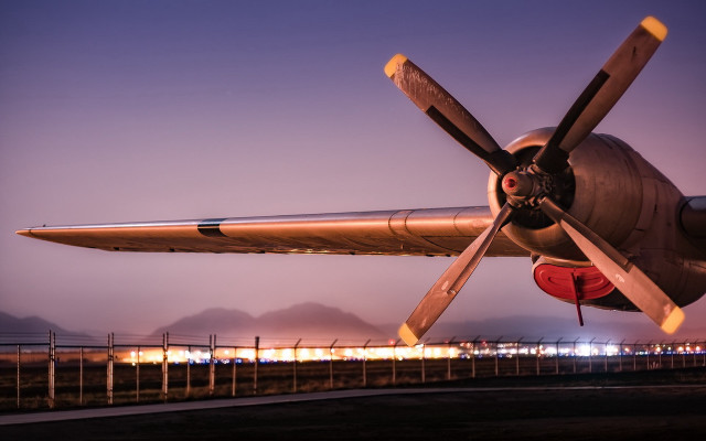 Propeller plane airport tarmac night free wallpaper - medium preview image