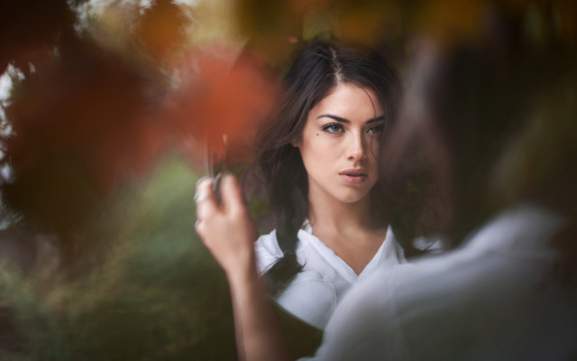Woman umbrella serious portrait blurry free wallpaper - medium preview image