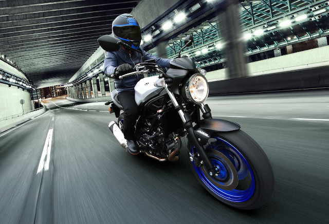 Man riding motorcycle night street free wallpaper - medium preview image