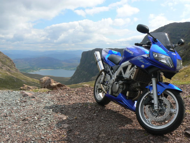 Blue motorcycle lake hill mountains free wallpaper - medium preview image