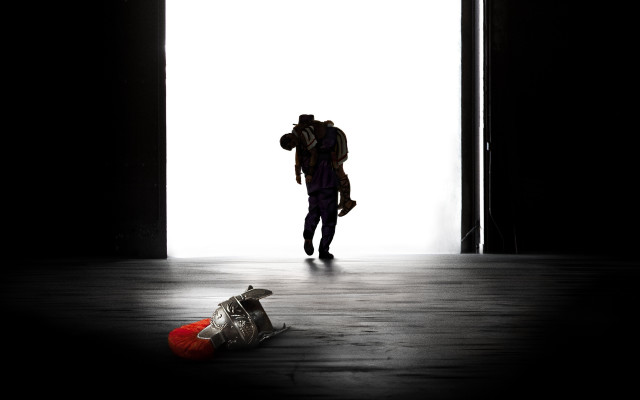 Person walking dark room backpack free wallpaper - medium preview image