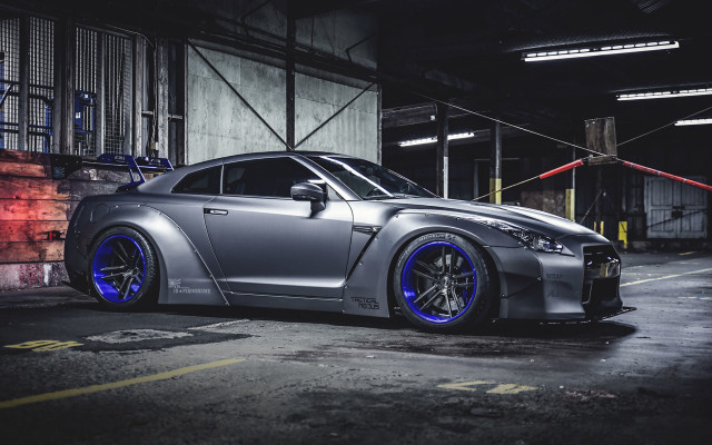 Silver sportscar parkinggarage blue tires free wallpaper - medium preview image