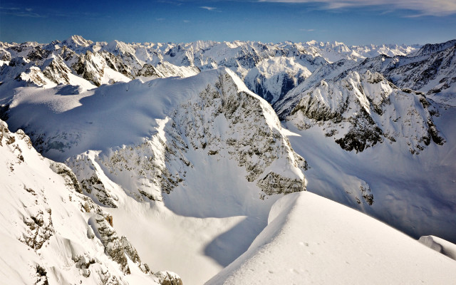 Snowy mountain skier blue sky free wallpaper - medium preview image