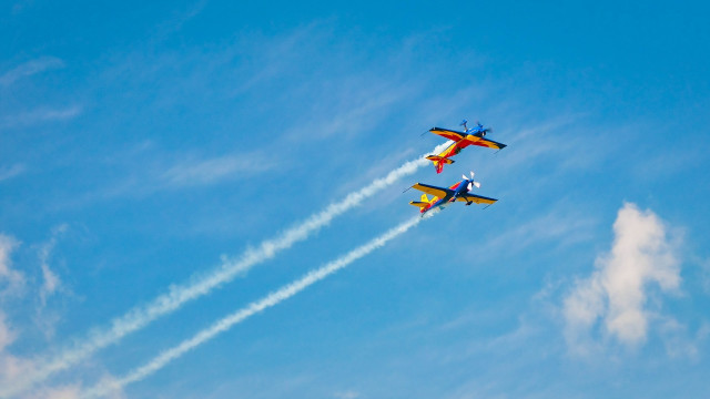 Airplanes smoke trailing sky clouds free wallpaper - medium preview image