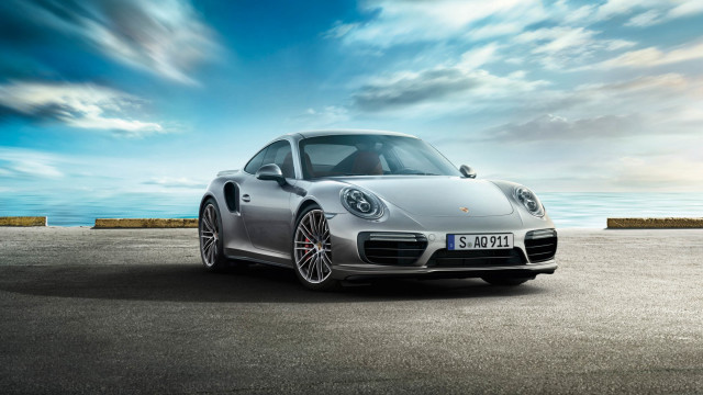 Silver porsche ocean cloudy sky free wallpaper - medium preview image