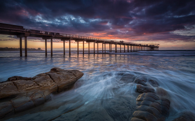 Pier sunset ocean waves rock free wallpaper - medium preview image