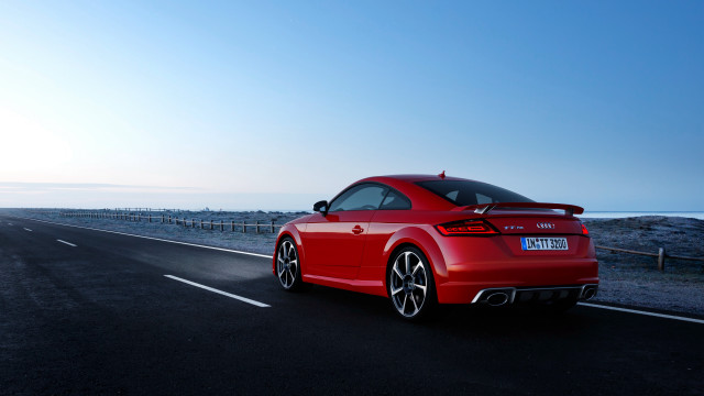 Red car road grass fence free wallpaper - medium preview image