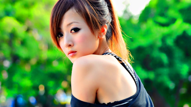 Woman ponytail black top posing free wallpaper - medium preview image
