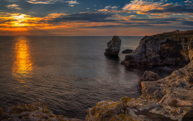 Sunset ocean rock formation shore free wallpaper - medium preview image