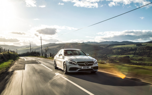 White car green hillside blue free wallpaper - medium preview image