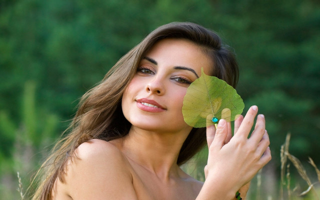 Woman holding leaf posing picture #2 free wallpaper - medium preview image