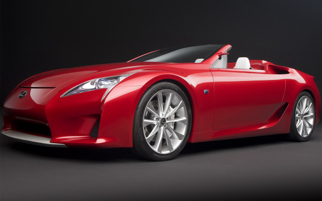 Red sports car studio shot free wallpaper - medium preview image