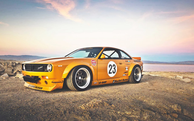 Yellow car rocky road water free wallpaper - medium preview image