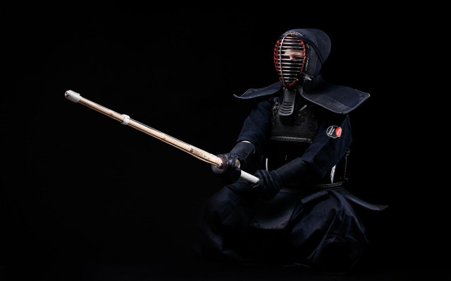 Costumed portrait armor helmet sword free wallpaper - medium preview image