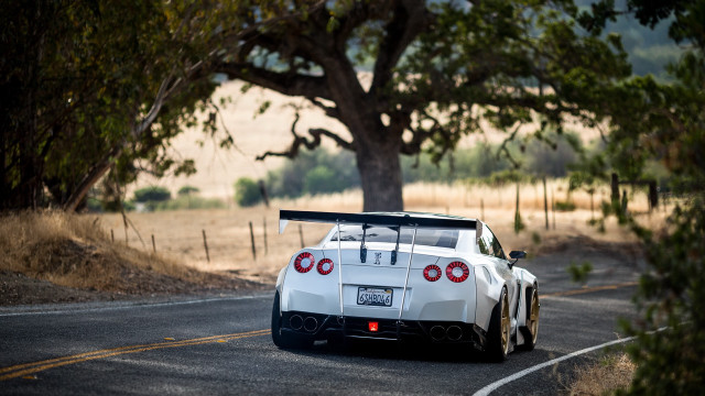 White sports car driving road #7 free wallpaper - medium preview image