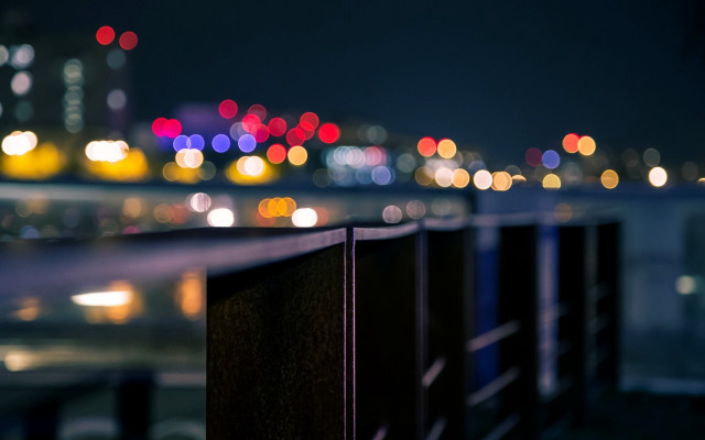 City skyline night fence bokeh free wallpaper - medium preview image