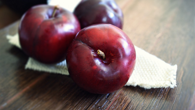 Three plums on cloth still free wallpaper - medium preview image
