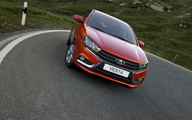 Red car winding road hillside free wallpaper - medium preview image
