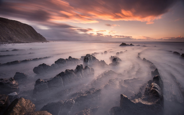 Sunset rocky beach mist orange free wallpaper - medium preview image