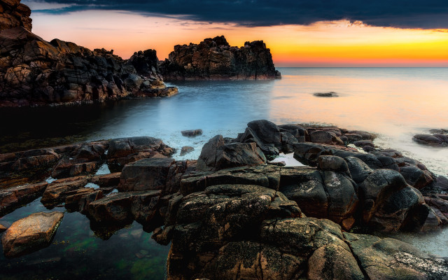 Rocky shore sunset water formation free wallpaper - medium preview image