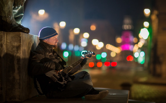 Man sitting ledge bass guitar free wallpaper - medium preview image