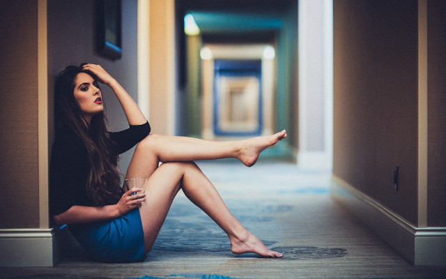 Woman sitting hallway crossed leg free wallpaper - medium preview image