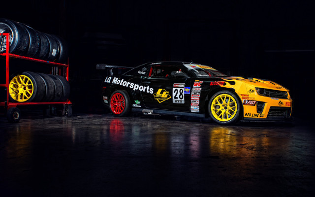 Yellow car tires dark room free wallpaper - medium preview image