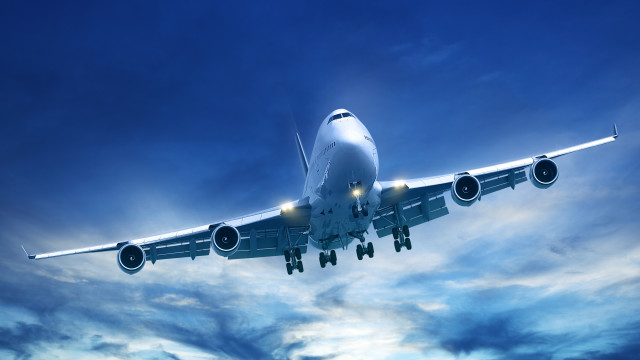 Large jetliner flying cloudy sky #3 free wallpaper - medium preview image