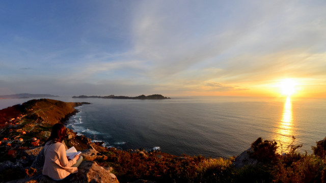 Woman ocean sunset rock beach free wallpaper - medium preview image
