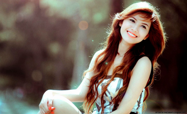Woman smiling bench long hair free wallpaper - medium preview image