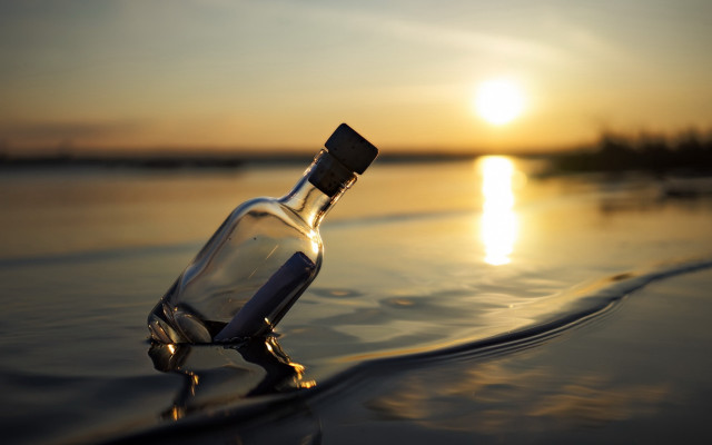 Beach sunset bottle reflection surreal free wallpaper - medium preview image