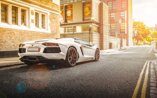 White sports car street cityscape free wallpaper - medium preview image