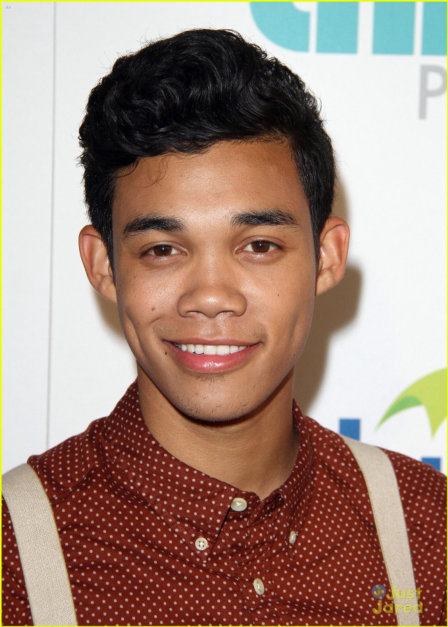 Young man smiling suspenders camera free wallpaper - medium preview image