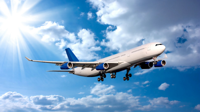 Jetliner flying blue sky sunbeams #2 free wallpaper - medium preview image