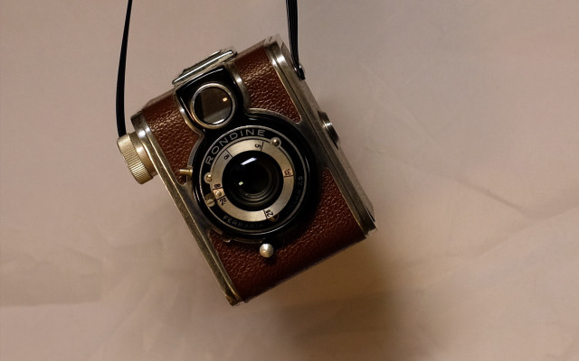 Brown camera white table phone free wallpaper - medium preview image