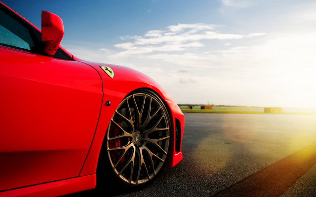 Red sports car sunshine blue free wallpaper - medium preview image