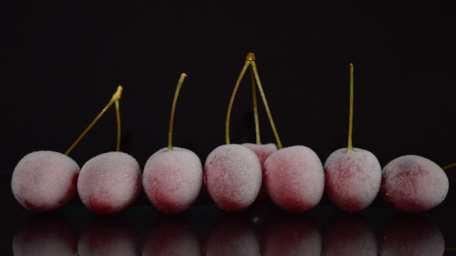 Pink fruit row black surface free wallpaper - medium preview image