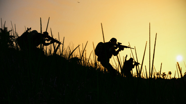 Sunset silhouette gun outdoors utility free wallpaper - medium preview image